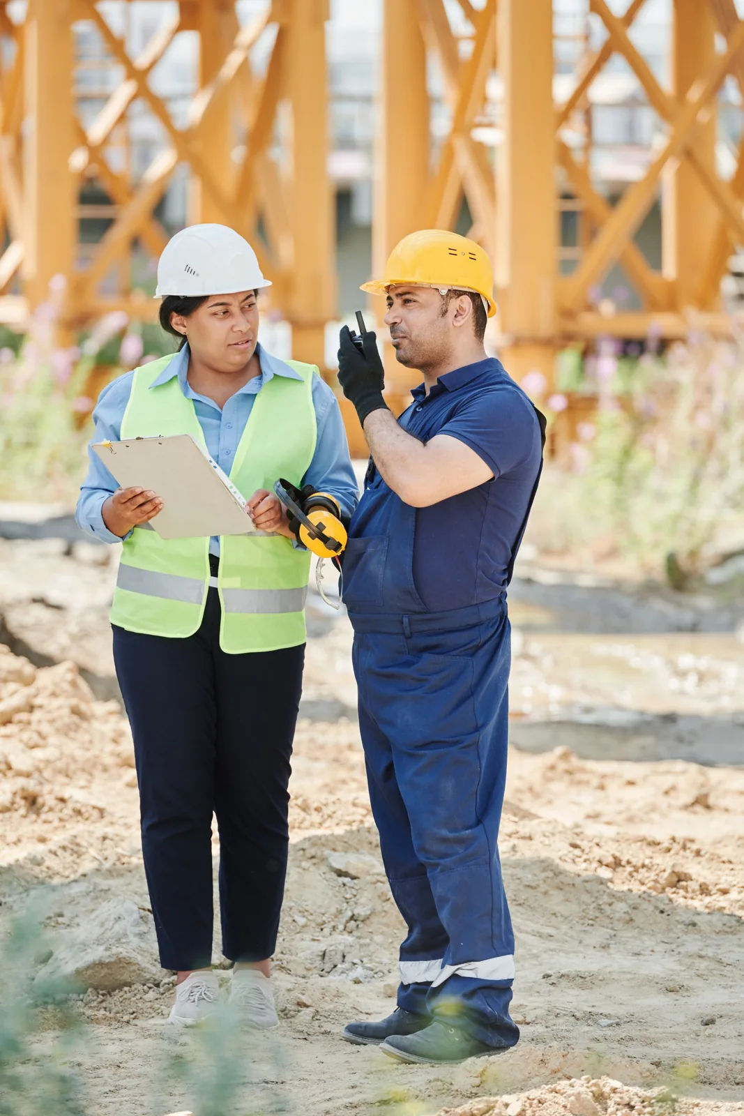 Construction professionals reviewing drawings on site
